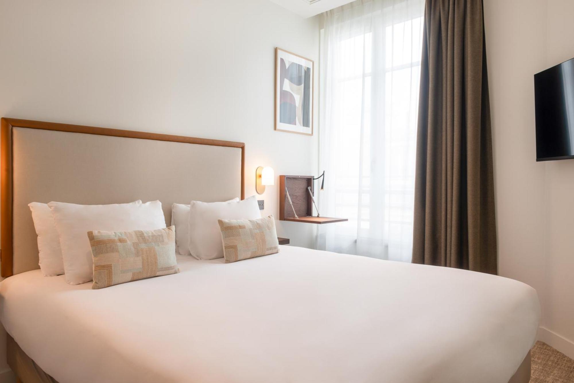 Le Lampika Hotel Paris Værelse billede